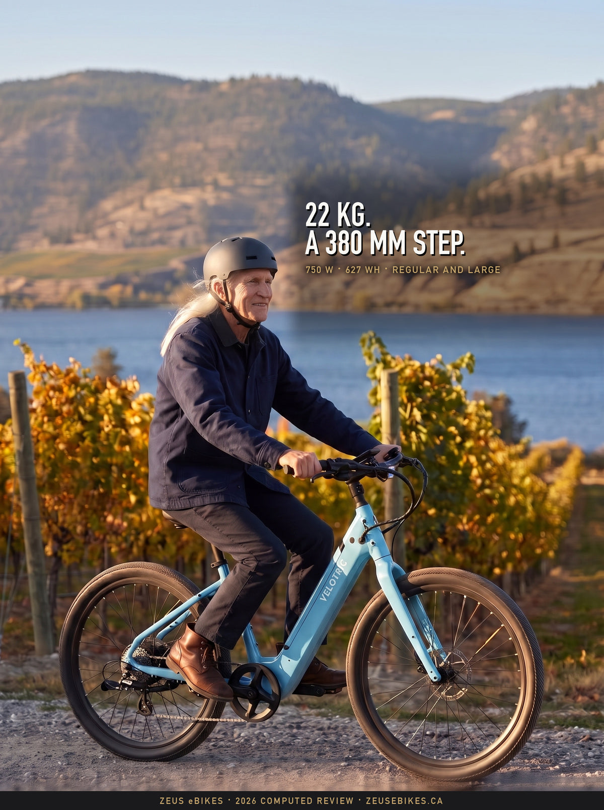 Zeus smiles as he rides a pale blue Velotric Breeze 1 step-through between golden vine rows above Okanagan Lake, a Playcut rendering, under the headline 22 kg, a 380 mm step.