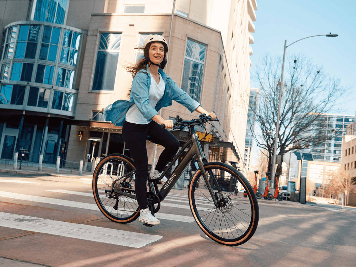 Rider on a Velotric Tempo on a city street (Velotric photo) — Zeus eBikes Canada