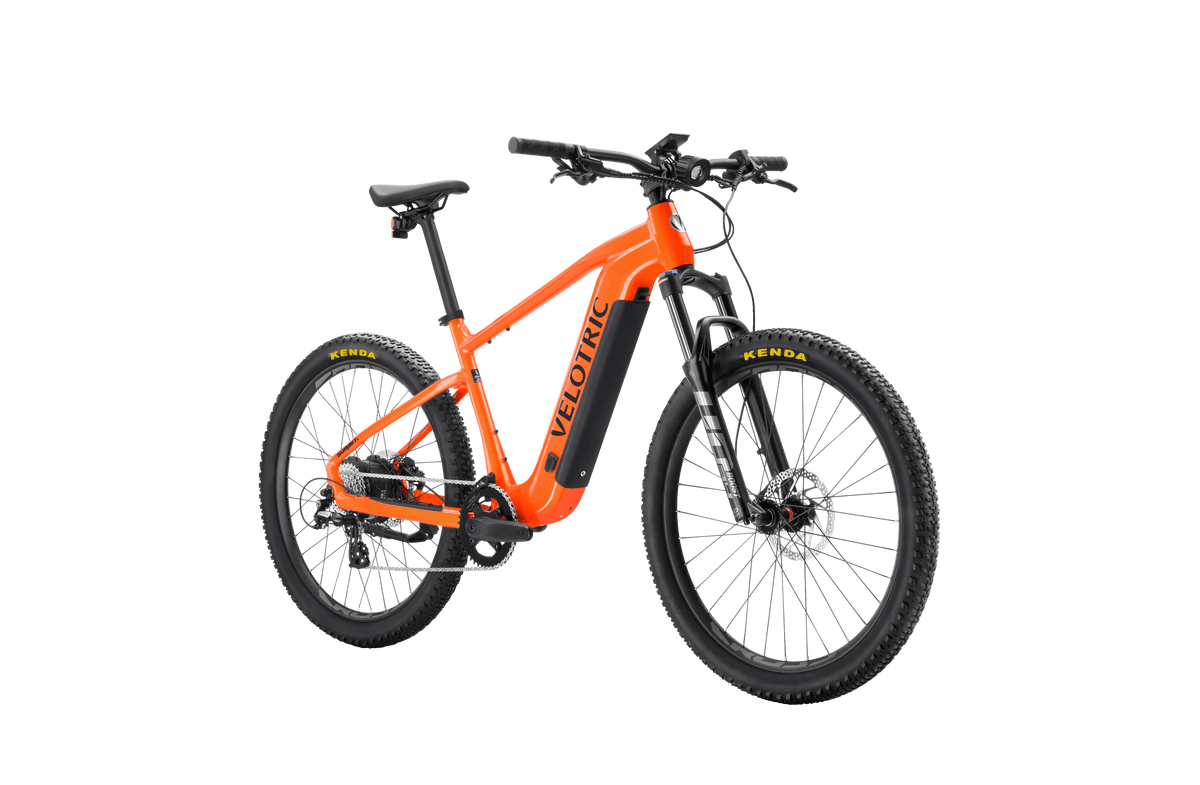 Velotric Summit 1 in Sunrise Orange, front three-quarter view — Zeus eBikes Canada