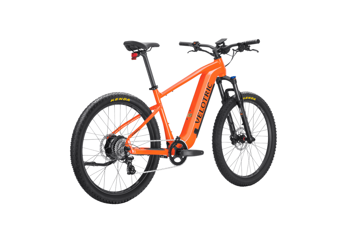 Velotric Summit 1 in Sunrise Orange, rear three-quarter view — Zeus eBikes Canada