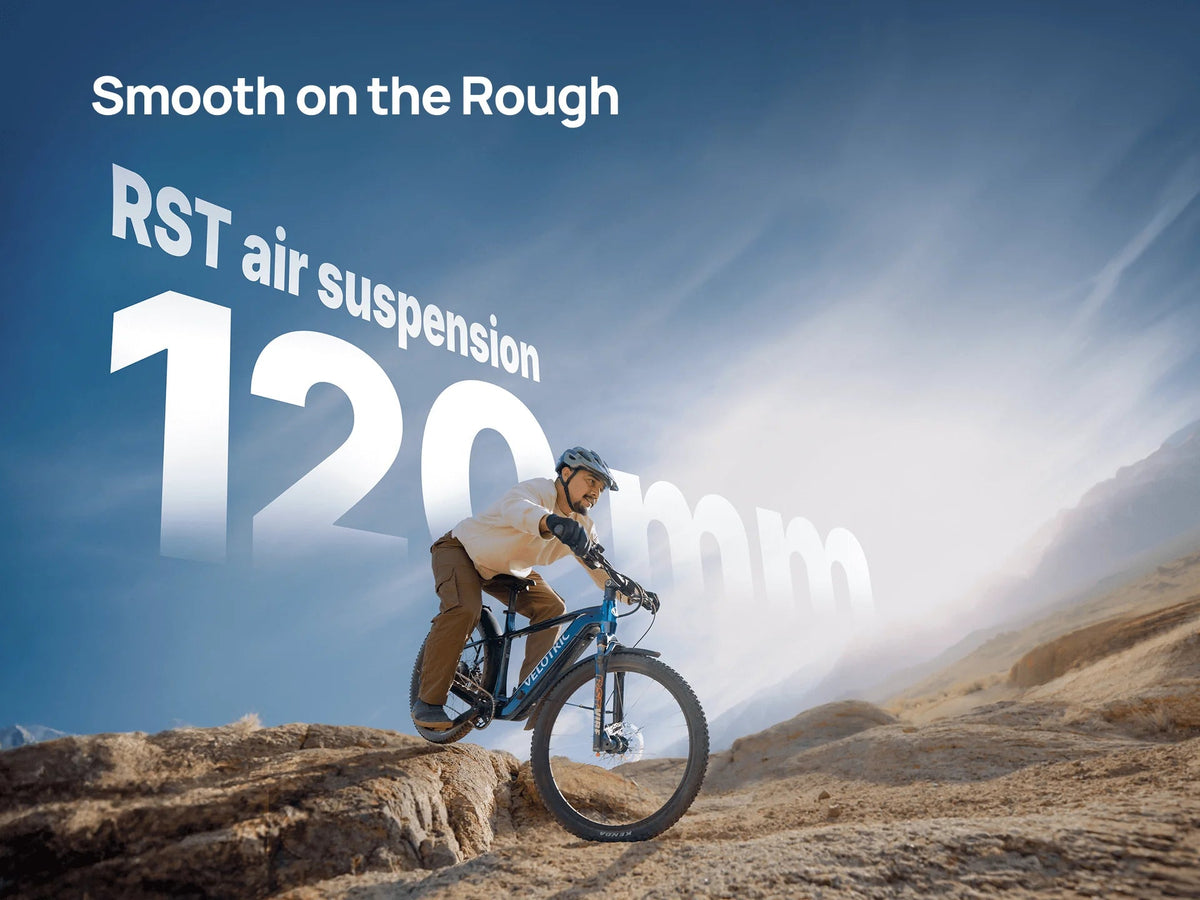 Velotric graphic of a rider on a Velotric Summit 2 on rough ground, captioned RST air suspension 120 mm — Zeus eBikes Canada