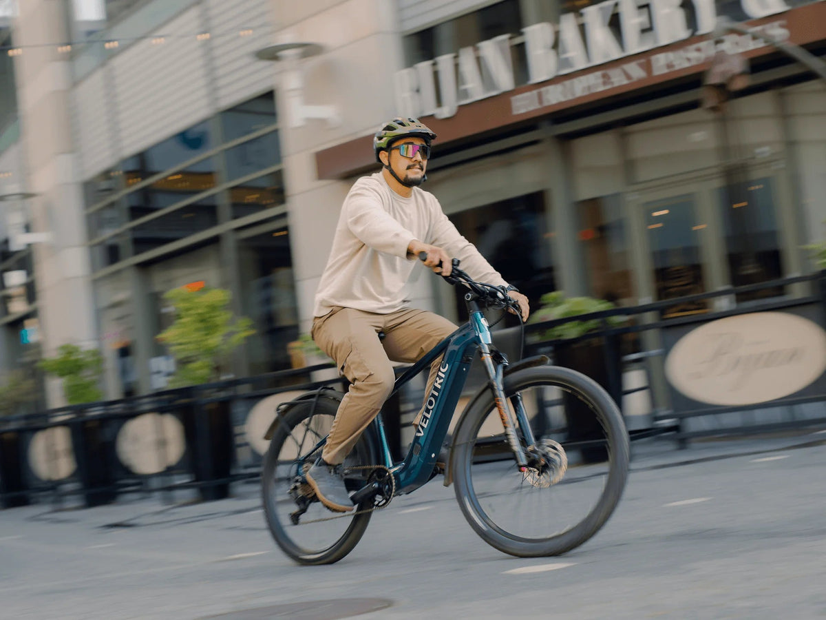 Rider on a Velotric Summit 2 on a city street (Velotric photo) — Zeus eBikes Canada