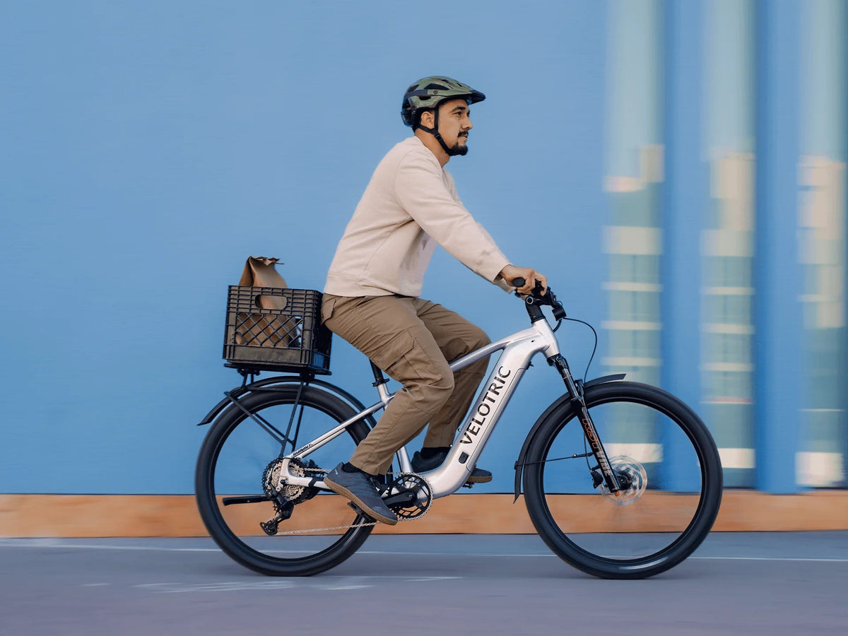 Rider on a Velotric Summit 2 with an optional rear rack and basket, sold separately (Velotric photo) — Zeus eBikes Canada