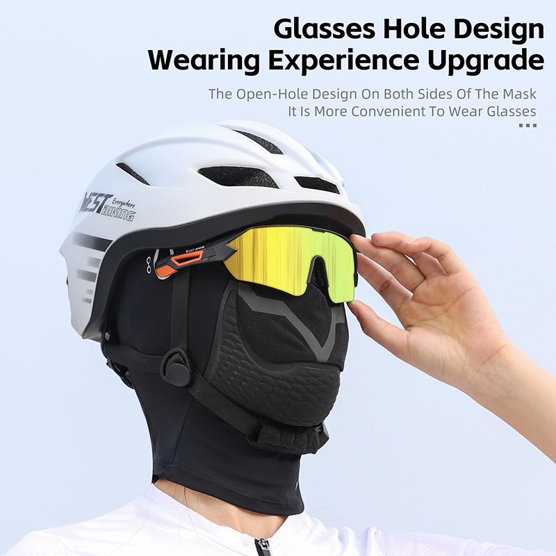 Rider fitting sunglasses through the side holes of the balaclava under a white cycling helmet, with the supplier's caption about the glasses-hole design — Zeus eBikes Canada