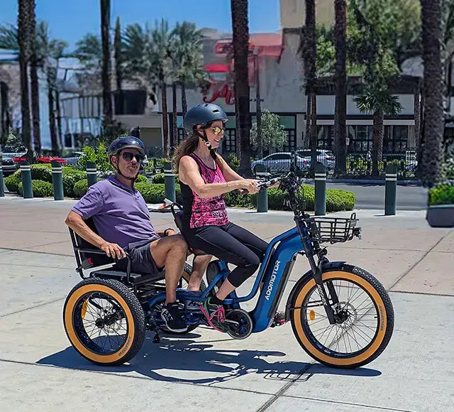 Two adults riding an Addmotor Greattan L in Neptune Blue, the passenger on the rear seat (image: Addmotor)