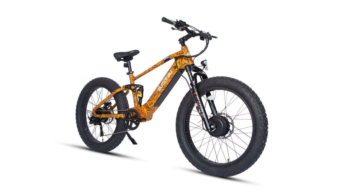 Eunorau Defender-S 2.0 in Dry Grass Camo, front three-quarter view: suspension fork, front hub motor and headlight — Zeus eBikes Canada