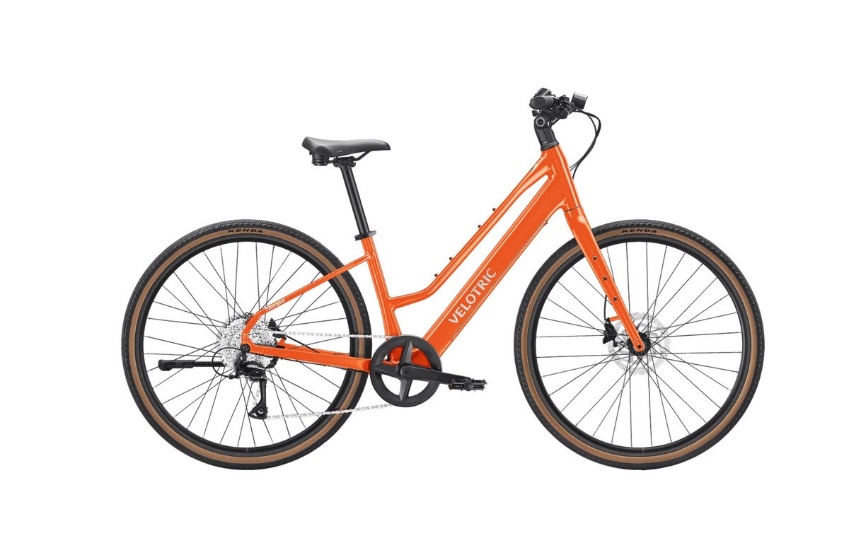 Velotric Tempo Mid-Step in Sunset Tangerine, side view — Zeus eBikes Canada