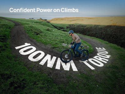 Velotric graphic of a rider climbing a grassy hill on a Velotric Summit 2, captioned 100 Nm torque — Zeus eBikes Canada