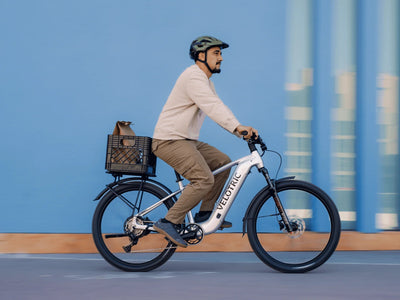 Rider on a Velotric Summit 2 with an optional rear rack and basket, sold separately (Velotric photo) — Zeus eBikes Canada