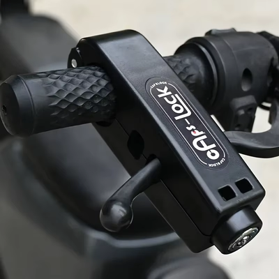 Close-up of the black grip lock fitted over a handlebar grip and brake lever — Zeus eBikes Canada