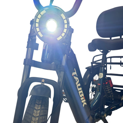 Taubik Axis headlight lit, with the backrest saddle behind, Gentian Blue frame (Taubik photo) — Zeus eBikes Canada