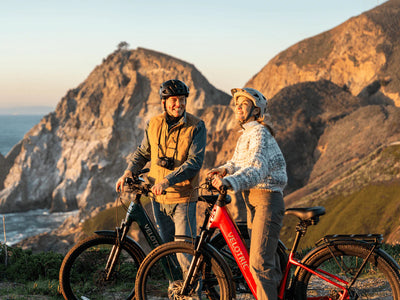 Two riders with Velotric Discover 3 e-bikes at a mountain lookout (Velotric photo) — Zeus eBikes Canada