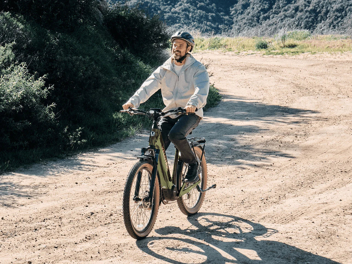 Rider on a Velotric Discover M on a dirt trail (Velotric photo) — Zeus eBikes Canada