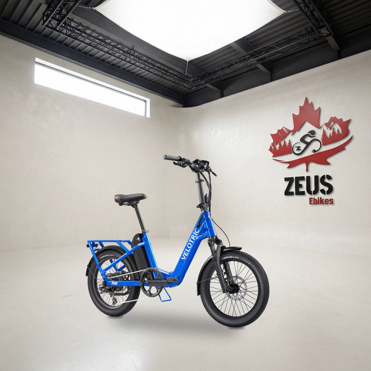 Velotric Fold 1 Plus folding e-bike in Electric Blue: Velotric's own photo set in the Zeus eBikes studio — Zeus eBikes Canada
