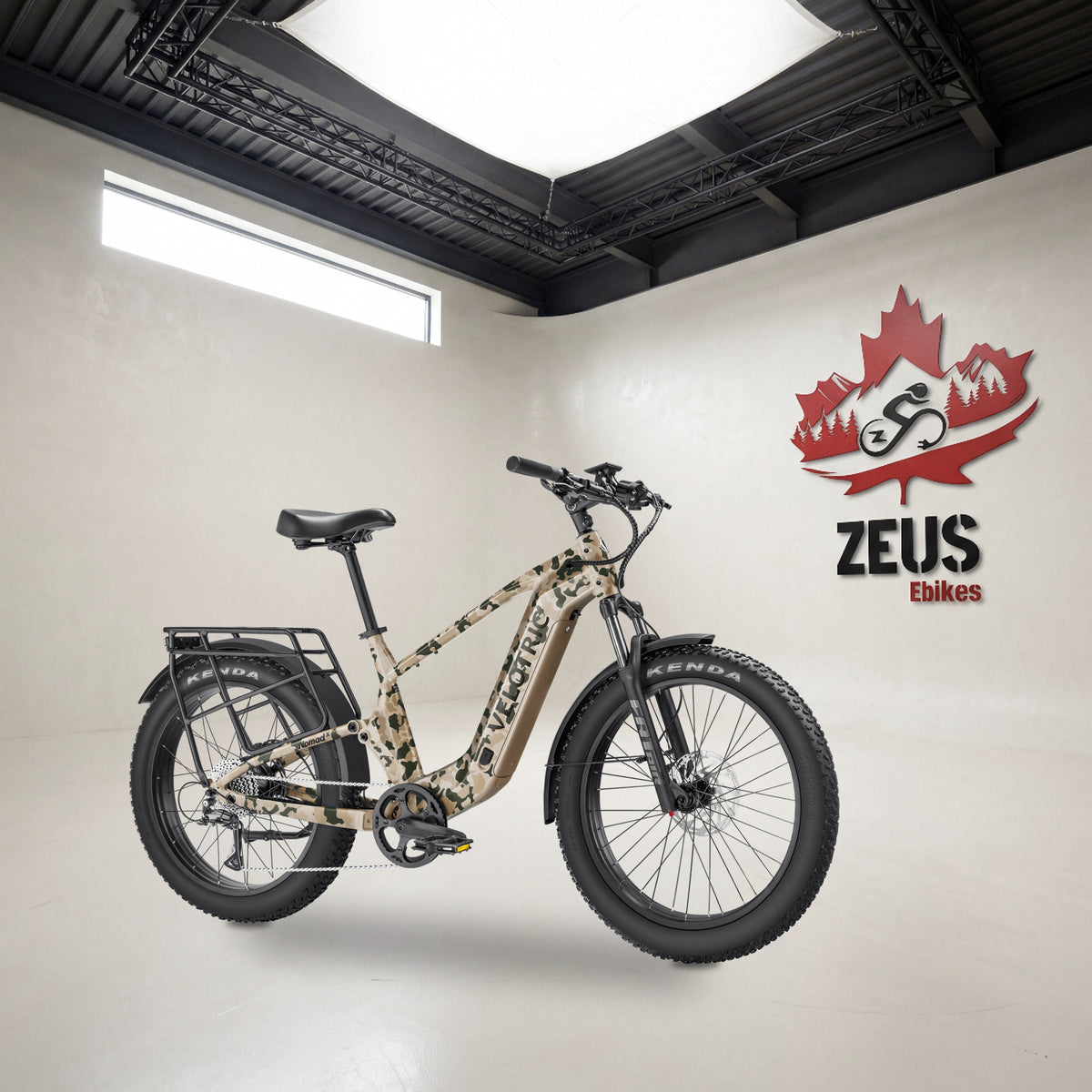 Velotric Nomad 2X full-suspension fat-tire e-bike, High-Step frame in Multi-Terrain Camo: Velotric's own photo set in the Zeus eBikes studio — Zeus eBikes Canada