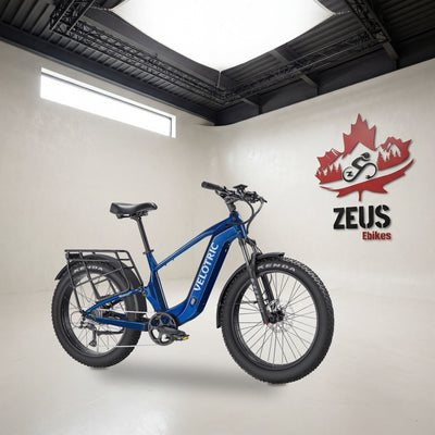 Velotric Nomad 2X full-suspension fat-tire e-bike, High-Step frame in Royal Blue: Velotric's own photo set in the Zeus eBikes studio — Zeus eBikes Canada