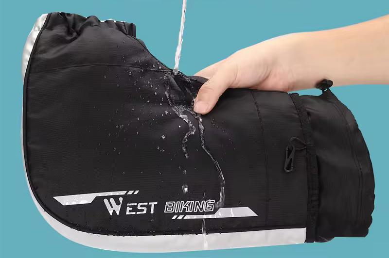 Supplier’s photo: water poured over a West Biking handlebar mitten with a hand inside — Zeus eBikes Canada