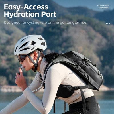 Supplier photo of a cyclist drinking from a tube routed over the shoulder strap of the West Biking hydration backpack — Zeus eBikes Canada