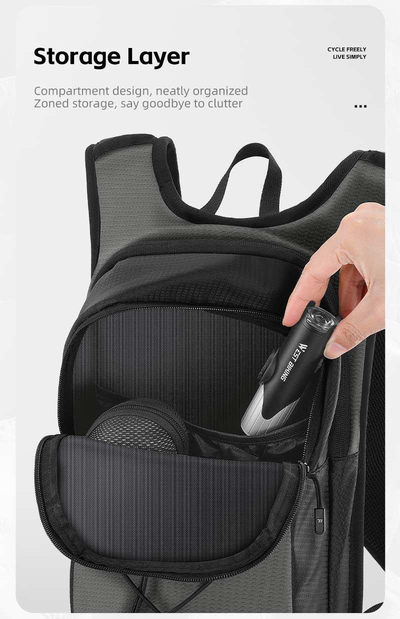 Supplier photo of the storage layer of the West Biking hydration backpack opened, with a hand placing an item inside — Zeus eBikes Canada
