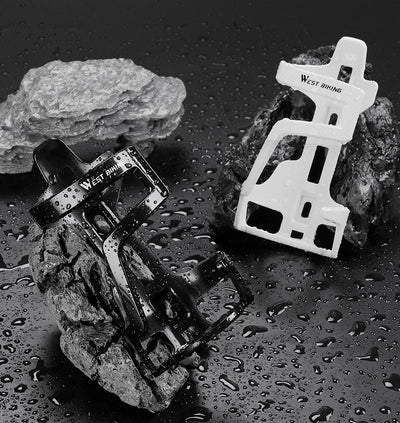 Black and white PC plastic bottle cages on wet rock