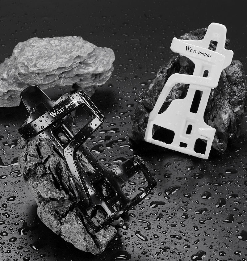 Black and white PC plastic bottle cages on wet rock